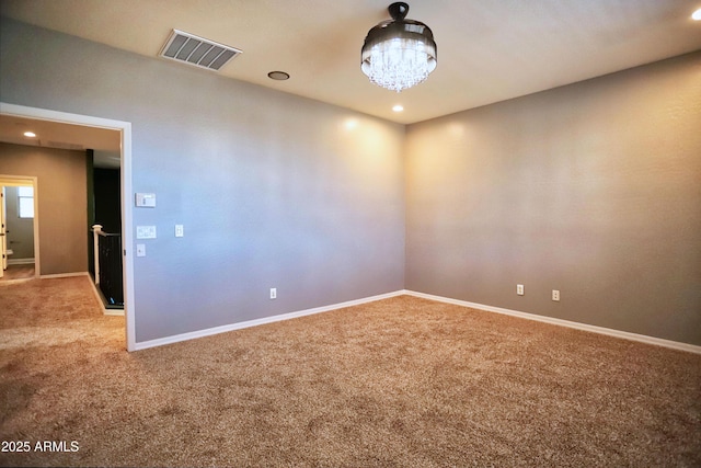 carpeted spare room featuring a chandelier, recessed lighting, visible vents, and baseboards