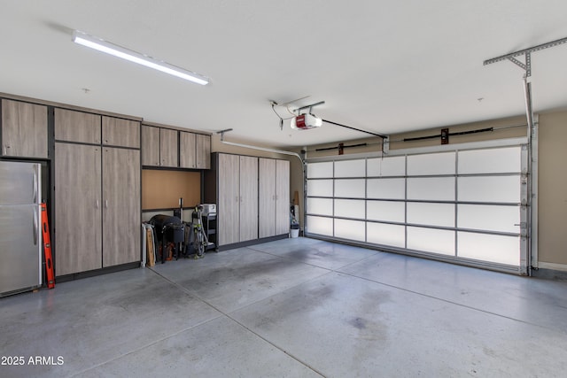 312 S Hardy Dr Unit 106, Tempe, AZ 85281 - garage featuring freestanding refrigerator and a garage door opener