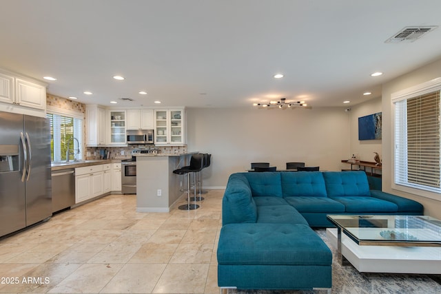 312 S Hardy Dr Unit 106, Tempe, AZ 85281 - living room with recessed lighting