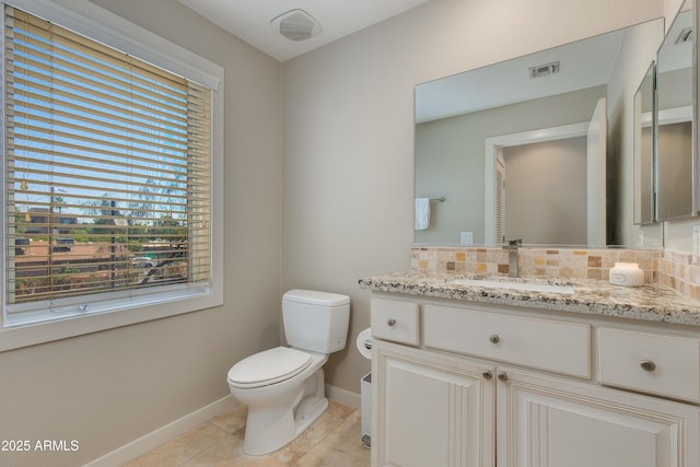 312 S Hardy Dr Unit 106, Tempe, AZ 85281 - bathroom with vanity, tile patterned floors, and decorative backsplash