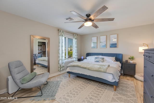 312 S Hardy Dr Unit 106, Tempe, AZ 85281 - bedroom featuring light wood-style floors and ceiling fan