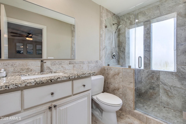 312 S Hardy Dr Unit 106, Tempe, AZ 85281 - full bathroom with vanity, a stall shower, tile walls, and ceiling fan