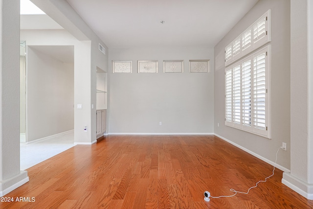 spare room featuring light hardwood / wood-style flooring