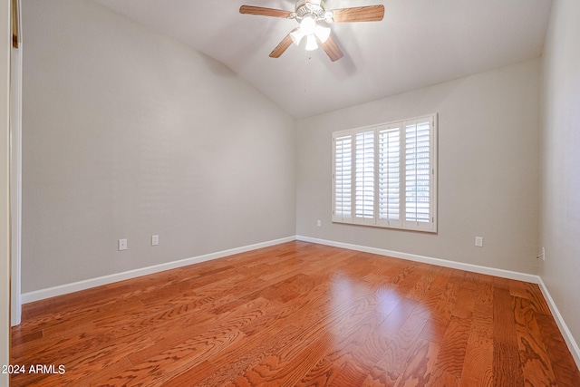 unfurnished room featuring ceiling fan, lofted ceiling, and hardwood / wood-style floors