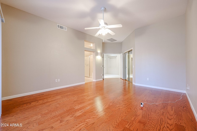 unfurnished room featuring light wood-type flooring and ceiling fan