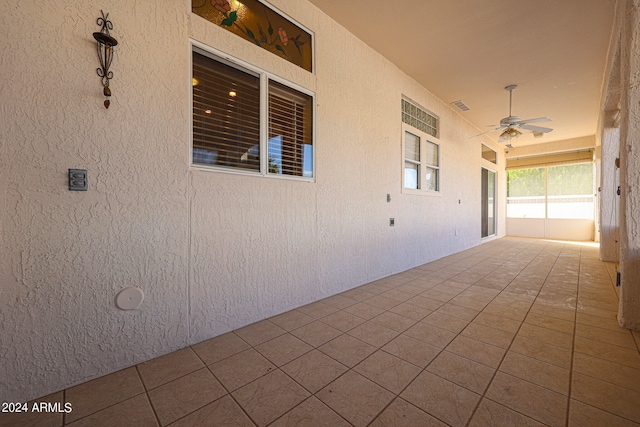 view of patio featuring ceiling fan