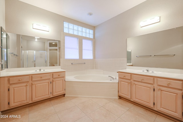 bathroom featuring vanity, shower with separate bathtub, and tile patterned flooring