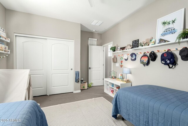 bedroom featuring a closet, visible vents, a ceiling fan, and carpet