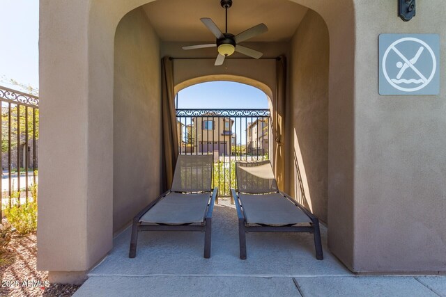 view of patio featuring ceiling fan