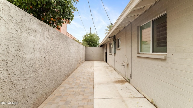 524 W Fairway Dr Unit 10, Mesa, AZ 85201 - view of side of home featuring a fenced backyard and a patio area