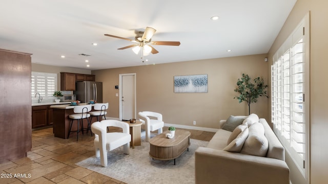 524 W Fairway Dr Unit 10, Mesa, AZ 85201 - living area featuring ceiling fan, recessed lighting, stone tile floors, and baseboards