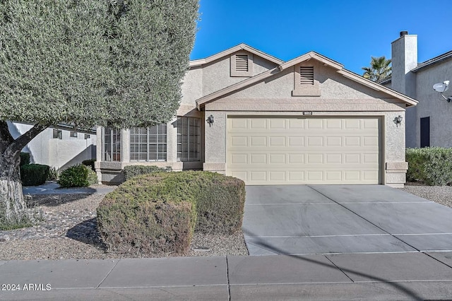 view of front of property featuring a garage