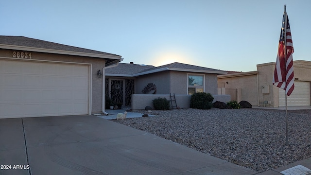 single story home featuring a garage