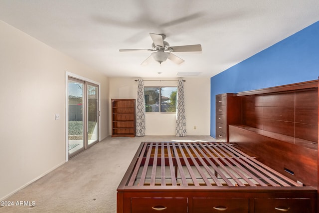 interior space featuring light carpet and ceiling fan