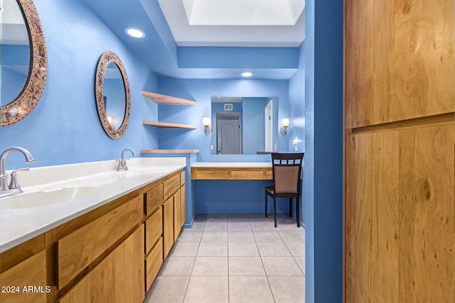 bathroom with tile patterned floors and vanity