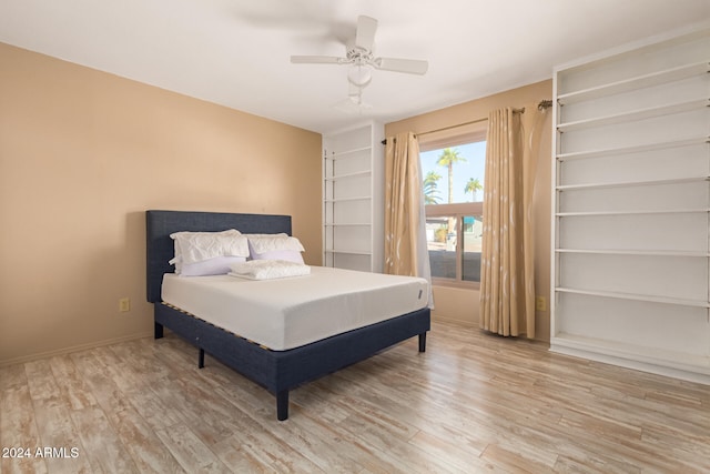 bedroom featuring ceiling fan and hardwood / wood-style flooring