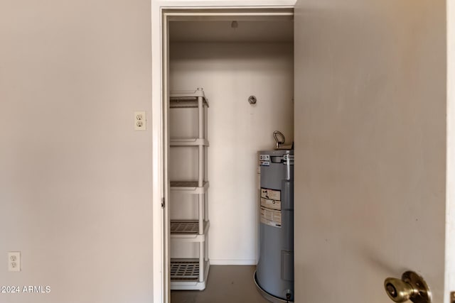 utility room with water heater