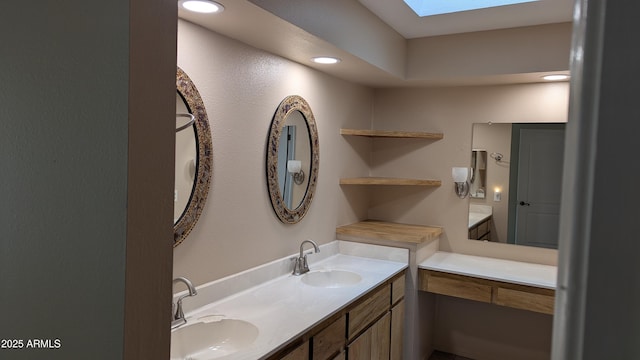 bathroom with vanity and a skylight