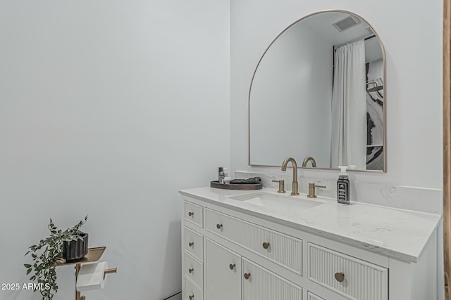 bathroom featuring vanity and visible vents