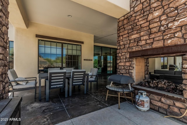 view of patio featuring outdoor dining area