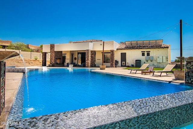 view of pool with a fenced in pool, cooling unit, and a patio area