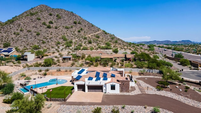 birds eye view of property featuring a mountain view