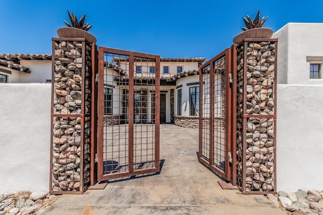 view of gate with fence