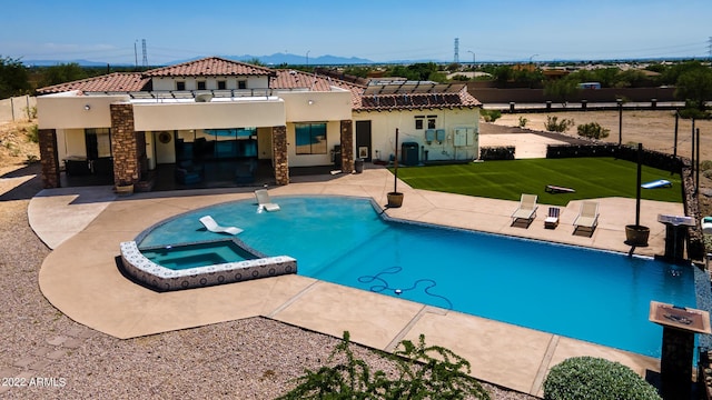 back of property with a patio, stucco siding, a pool with connected hot tub, and a tiled roof