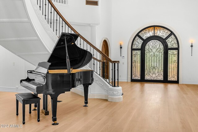 entrance foyer featuring light wood-type flooring and a high ceiling