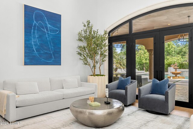 living room featuring wood-type flooring and french doors