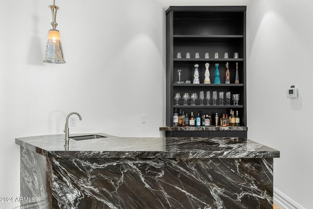 bar with built in shelves and sink