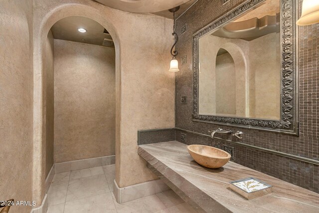 bathroom featuring tile patterned flooring and vanity