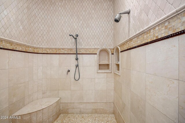 bathroom with a tile shower