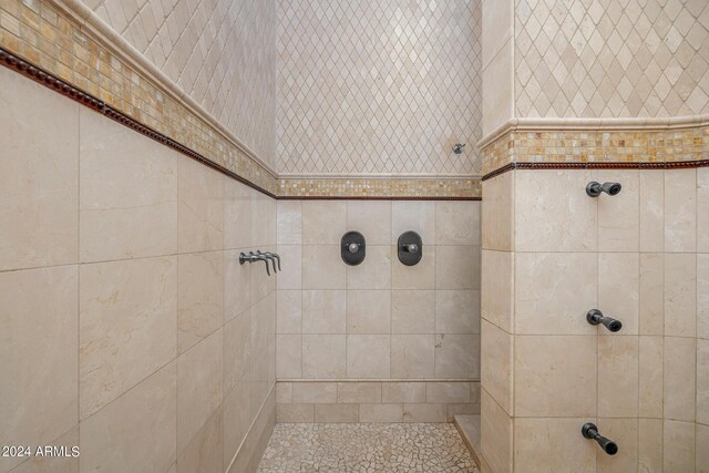 bathroom with a tile shower