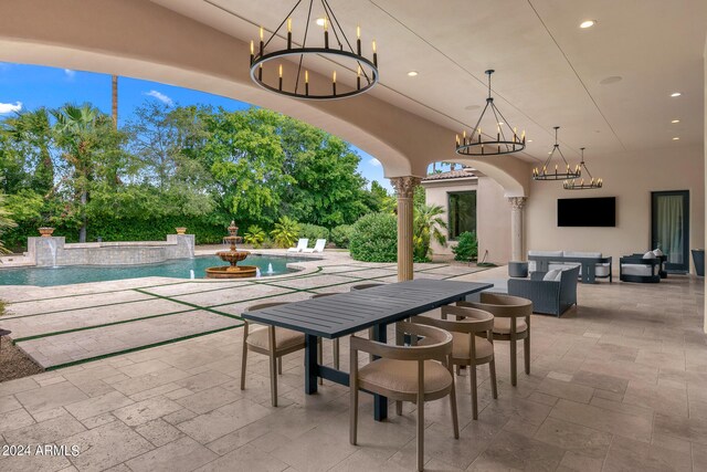 view of patio featuring pool water feature and an outdoor hangout area