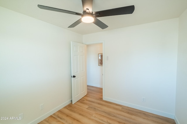 spare room featuring ceiling fan and light hardwood / wood-style flooring