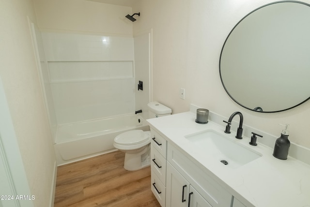 full bathroom with toilet, hardwood / wood-style floors, vanity, and shower / bath combination