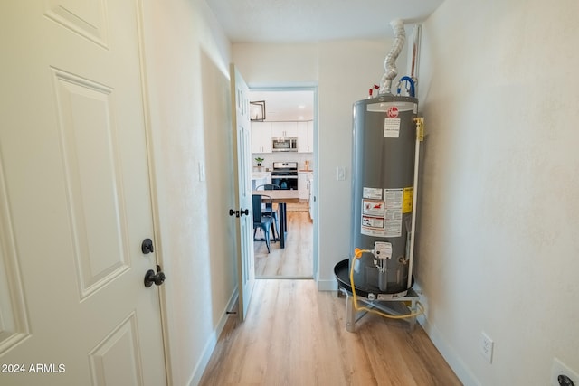 utility room with gas water heater