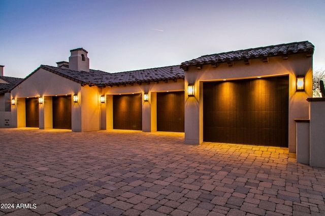 mediterranean / spanish house with a garage