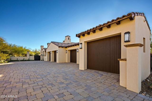 mediterranean / spanish house with a garage