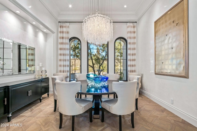 dining space featuring light parquet flooring, crown molding, and an inviting chandelier