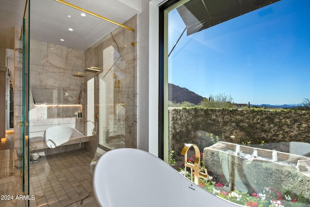 bathroom with shower with separate bathtub