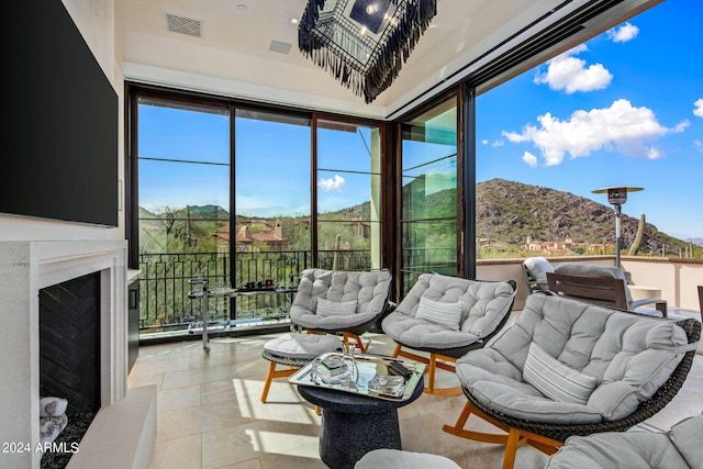 sunroom / solarium with a mountain view