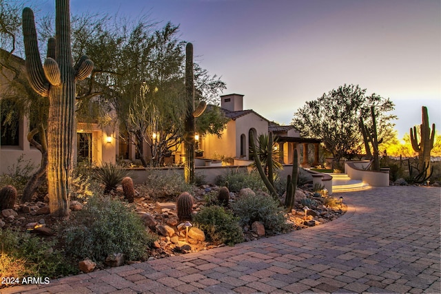 view of property exterior at dusk