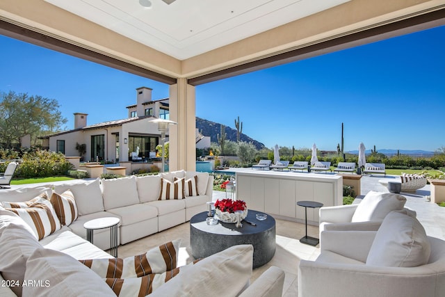 view of terrace featuring a mountain view and an outdoor hangout area