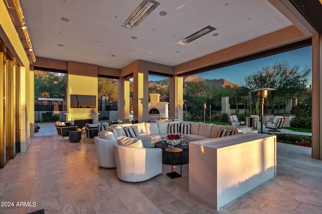 view of terrace with a mountain view and an outdoor hangout area