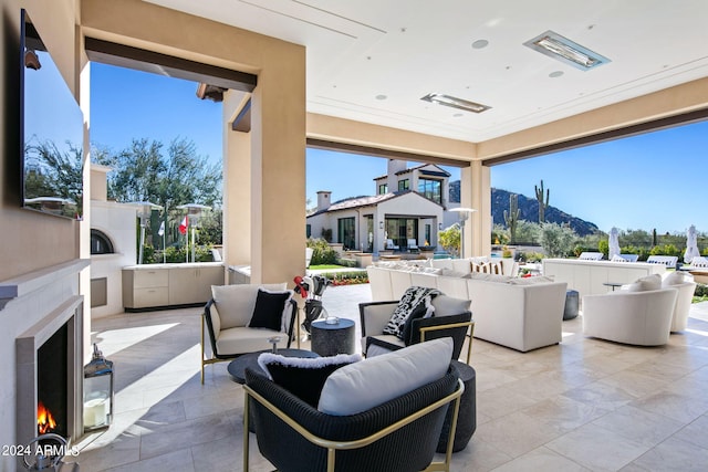 interior space featuring outdoor lounge area and a mountain view