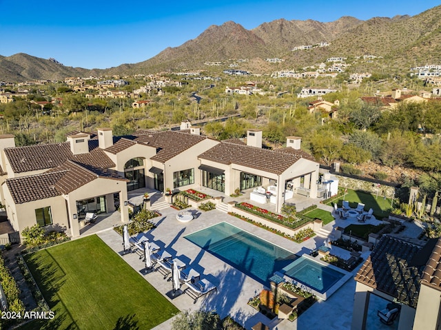 birds eye view of property featuring a mountain view