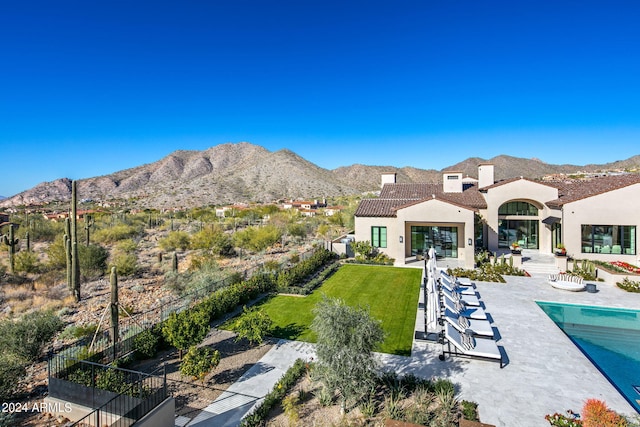 exterior space featuring a patio area and a mountain view