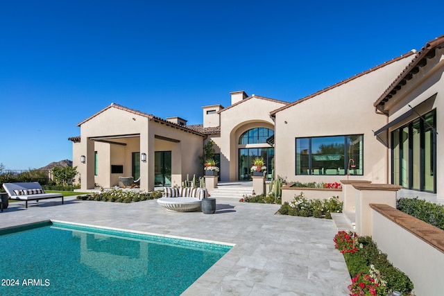 back of house with a patio area